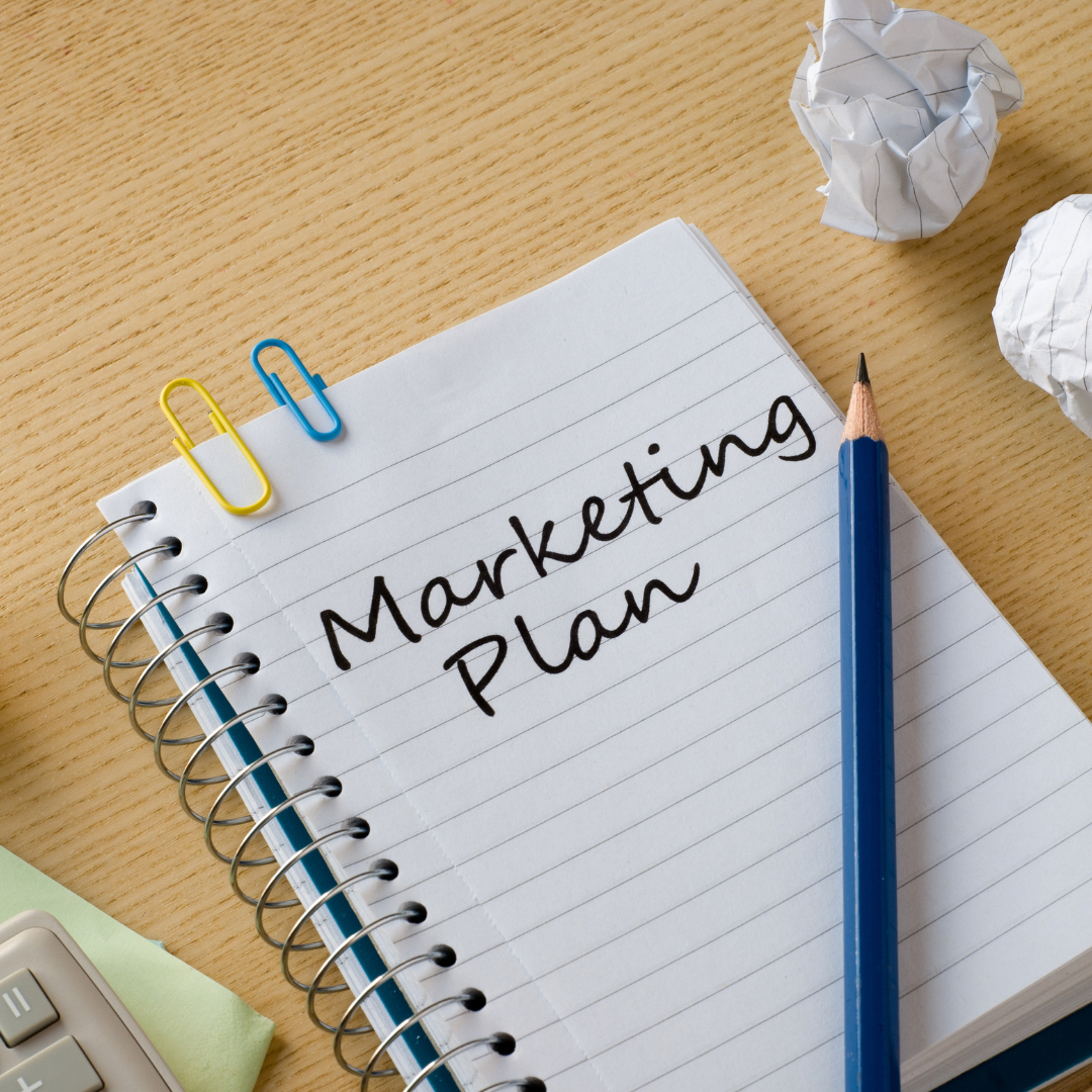 marketing plan with pencil and paper
